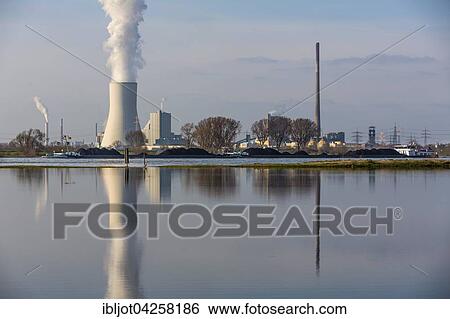 Cooling tower of the Duisburg Walsum coal power plant, reflection in the flooded Rheinwiese, ship transporting coal, Duisburg, North Rhine-Westphalia, Germany, Europe View Large Photo Image Stock Photograph - Cooling tower of the Duisburg Walsum coal power plant, reflection in the flooded Rheinwiese, ship transporting coal, Duisburg, North Rhine-Westphalia, Germany, Europe. Fotosearch