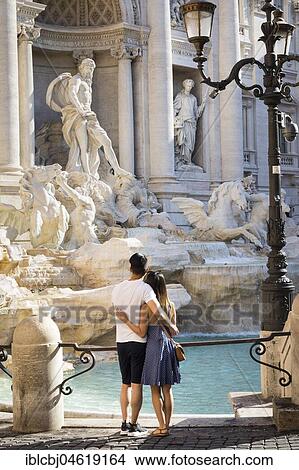 Couple at the Trevi fountain, Rome, Italy, Europe View Large Photo Image Picture - Couple at the Trevi fountain, Rome, Italy, Europe. Fotosearch