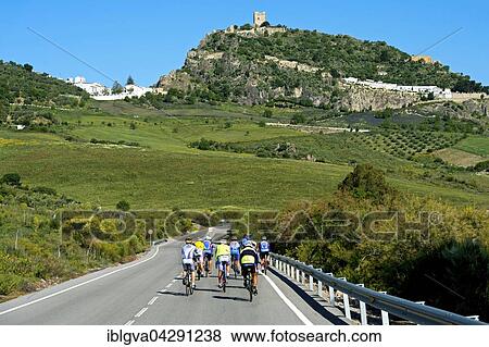 Cyclists on country road, hill with Moorish Castle keep, Zahara de la Sierra, Andalucia, Spain, Europe View Large Photo Image Stock Photo - Cyclists on country road, hill with Moorish Castle keep, Zahara de la Sierra, Andalucia, Spain, Europe. Fotosearch