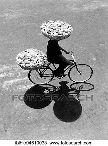 Cyclists transport buns, Mexico City, Mexico, Central America View Large Photo Image Stock Photo - Cyclists transport buns, Mexico City, Mexico, Central America. Fotosearch