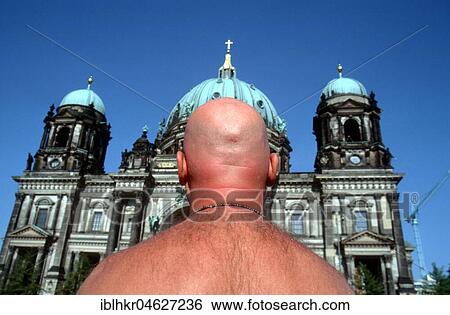 Stock Photograph - D, Berlin: Man with bald head in front of Berlin Cathedral, Berlin, Germany, Europe. Fotosearch