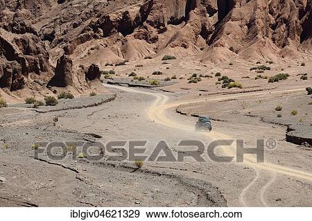 Desert landscape with dirt road in the Rainbow Valley, Valle Arcoiris, near San Pedro de Atacama, Región de Antofagasta, Chile, South America View Large Photo Image Stock Photo - Desert landscape with dirt road in the Rainbow Valley, Valle Arcoiris, near San Pedro de Atacama, Región de Antofagasta, Chile, South America. Fotosearch