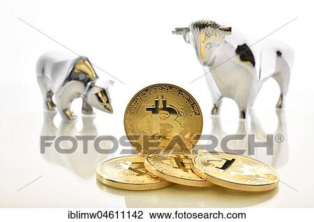 Stock Image - Digital currency, Bitcoin coins with bull and bear. Fotosearch
