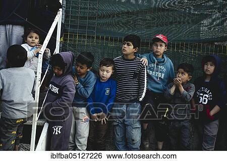 Stock Photograph - Distribution of milk powder and nappies for the refugees in Camp Moria, Lesbos, Greece, Europe. Fotosearch