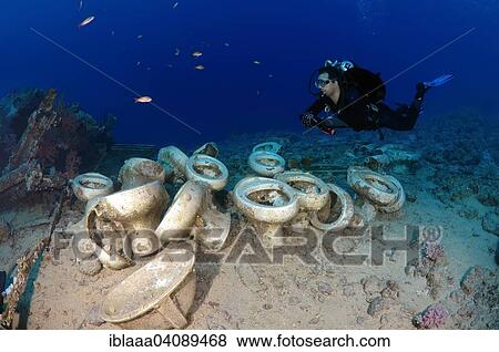 Stock Photo - Diver looking at the plumbing on the shipwrecks in Ras Muhammad National Park, Sharm el-Sheikh, Red sea, Egypt, Africa. Fotosearch