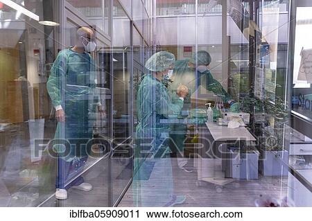 Stock Image - Doctors preparing to enter the Covid ward, Hospital Agatharied, Agatharied, Bavaria, Germany, Europe. Fotosearch