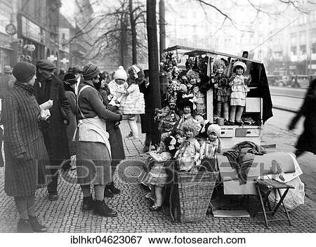 Stock Photo - Dolls street sale ca. 1930, exact place unknown, Germany, Europe. Fotosearch