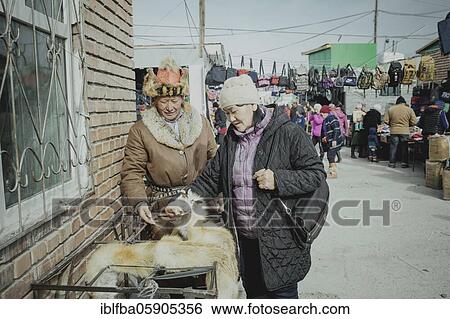 Eagle hunter Bashakhan Spai at the bazaar selling his fox furs, Kisil Tschar, Olgii, Mongolia, Asia View Large Photo Image Stock Photograph - Eagle hunter Bashakhan Spai at the bazaar selling his fox furs, Kisil Tschar, Olgii, Mongolia, Asia. Fotosearch