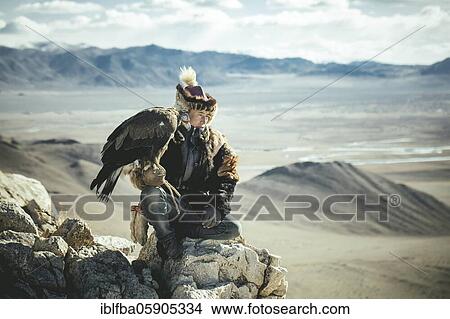 Eagle hunter Tileichan, son of Bashakhan Spai, hunting in the Kisil Czar, Olgii, Mongolia, Asia View Large Photo Image Picture - Eagle hunter Tileichan, son of Bashakhan Spai, hunting in the Kisil Czar, Olgii, Mongolia, Asia. Fotosearch