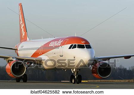 Stock Image - EasyJet, Airbus A320-214, landing, on taxiway, rolling, Munich Airport, Upper Bavaria, Germany, Europe. Fotosearch