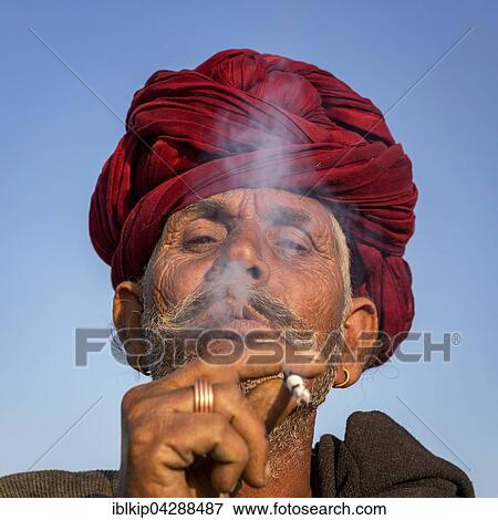 Stock Photo - Elderly Rajasthani man with an red turban, Pushkar, Rajasthan, India, Asia. Fotosearch