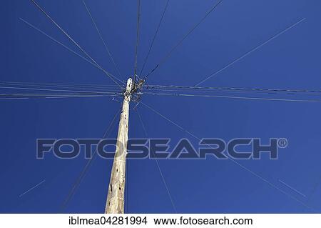 Electric cables and telephone lines attached to pylon, Uyuni Municipality, Bolivia, South America View Large Photo Image Picture - Electric cables and telephone lines attached to pylon, Uyuni Municipality, Bolivia, South America. Fotosearch