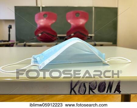 Empty classroom, seated, face mask and lettering KORONA on table, single tables without distance rule, Corona crisis, Germany, Europe View Large Photo Image Stock Image - Empty classroom, seated, face mask and lettering KORONA on table, single tables without distance rule, Corona crisis, Germany, Europe. Fotosearch