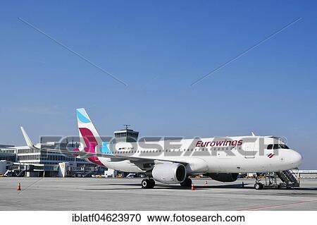 Eurowings, Airbus A 320, Apron East, Satellite in the background, Munich Airport, Upper Bavaria, Germany, Europe View Large Photo Image Stock Image - Eurowings, Airbus A 320, Apron East, Satellite in the background, Munich Airport, Upper Bavaria, Germany, Europe. Fotosearch