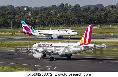 Eurowings Airbus A320 on the runway, Germanwings Airbus A319 on a taxiway, Dusseldorf Airport, Dusseldorf, North Rhine-Westphalia, Germany, Europe View Large Photo Image Stock Image - Eurowings Airbus A320 on the runway, Germanwings Airbus A319 on a taxiway, Dusseldorf Airport, Dusseldorf, North Rhine-Westphalia, Germany, Europe. Fotosearch