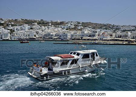 Excursion boat in the harbor of Mykonos Town or Chora, Mykonos, Cyclades, Greece, Europe View Large Photo Image Stock Photograph - Excursion boat in the harbor of Mykonos Town or Chora, Mykonos, Cyclades, Greece, Europe. Fotosearch