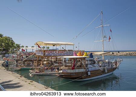 Excursion boats in the harbor, Side, Side Belediyesi, Antalya, Turkey, Asia View Large Photo Image Stock Image - Excursion boats in the harbor, Side, Side Belediyesi, Antalya, Turkey, Asia. Fotosearch