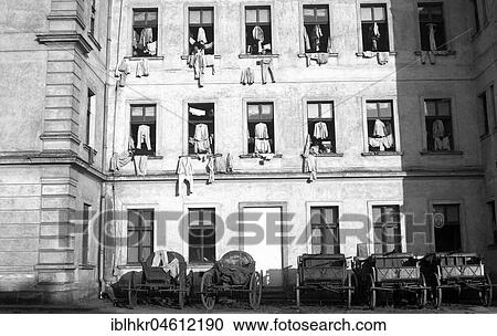 Facade of houses, on which clothes were hung for drying on window crosses, Freiburg ca. 1945 to 1955 View Large Photo Image Stock Image - Facade of houses, on which clothes were hung for drying on window crosses, Freiburg ca. 1945 to 1955. Fotosearch