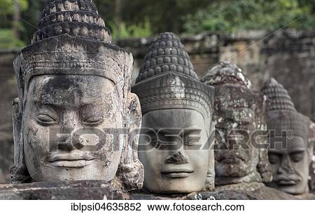 Faces of god statues on the balustrade of the South Gate causeway, Angkor Thom, Cambodia, Asia View Large Photo Image Stock Image - Faces of god statues on the balustrade of the South Gate causeway, Angkor Thom, Cambodia, Asia. Fotosearch