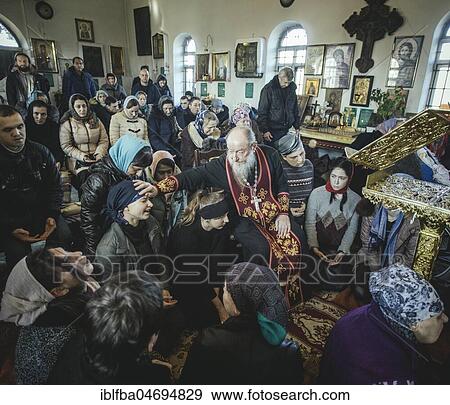 Father Sergei during an exorcism in his church in Ochamchira. He is widely known as an exorcist and receives people seeking help from all over Russia, Ochamchira, Abkhazia, Georgia, Asia View Large Photo Image Stock Photo - Father Sergei during an exorcism in his church in Ochamchira. He is widely known as an exorcist and receives people seeking help from all over Russia, Ochamchira, Abkhazia, Georgia, Asia. Fotosearch