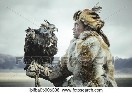 Stock Photograph - Festival of eagle hunters in the province of Olgii, about 20 km from the provincial capital. Various modalities of hunting, equestrian games and breaking in new mounts are presented, portrait of an eagle hunter, Olgii, Mongolia, Asia. Fotosearch