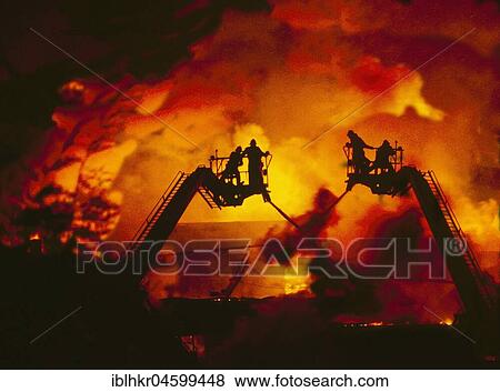 Stock Photo - Firefighters extinguish a fire, England, Great Britain. Fotosearch
