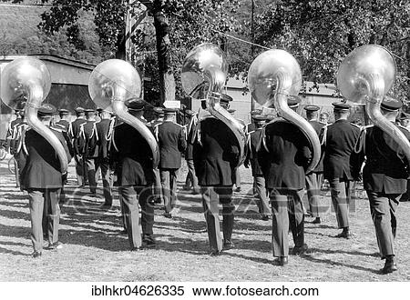 Stock Photography - Five large wind instruments during a parade ca. 1955, exact location unknown, Germany, Europe. Fotosearch