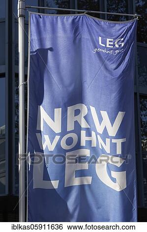 Stock Photograph - Flag of LEG Wohnen North Rhine-Westphalia, in front of the company headquarters, Düsseldorf, North Rhine-Westphalia, Germany, Europe. Fotosearch
