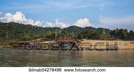 Stock Photograph - Floating houses on Tembeling River, rainforest, jungle, Kuala Tahan, Taman Negara, Malaysia, Asia. Fotosearch