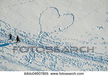 Footprints of pedestrians in the snow, heart, heart-shaped, Bergpark Wilhelmshöhe, Kassel, Hesse, Germany, Europe View Large Photo Image Stock Photography - Footprints of pedestrians in the snow, heart, heart-shaped, Bergpark Wilhelmshöhe, Kassel, Hesse, Germany, Europe. Fotosearch