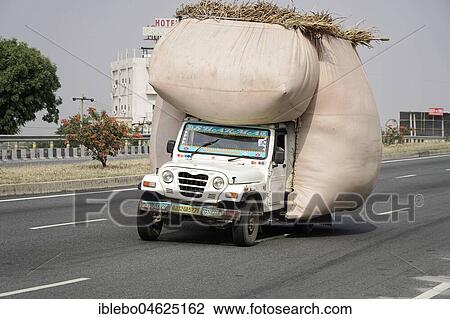 Stock Image - Fully loaded jeep, On the way near Jaipur, Rajasthan, India, Asia. Fotosearch