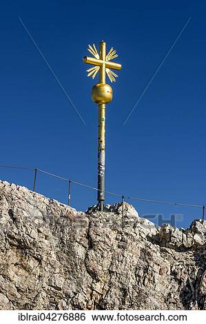 Gilded summit cross, Zugspitze, Garmisch-Partenkirchen, Wetterstein, Eastern Alps, Upper Bavaria, Bavaria, Germany, Europe View Large Photo Image Stock Photograph - Gilded summit cross, Zugspitze, Garmisch-Partenkirchen, Wetterstein, Eastern Alps, Upper Bavaria, Bavaria, Germany, Europe. Fotosearch