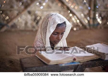 Girl reading in a madrasah, Koran school, camp for Rohingya refugees from Myanmar, Kutupalong, Cox Bazaar, Bangladesh, Asia View Large Photo Image Picture - Girl reading in a madrasah, Koran school, camp for Rohingya refugees from Myanmar, Kutupalong, Cox Bazaar, Bangladesh, Asia. Fotosearch