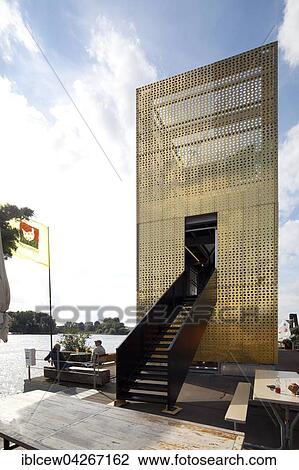 Stock Image - Golden Pavilion of Arts and Culture with Elbparkbrucke bridge, Elbpark Entenwerder, Rothenburgsort, Hamburg. Fotosearch