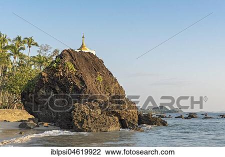 Stock Image - Golden stupa on rock at coastline, Ngapali Beach, Rakhine State, Myanmar, Burma, Asia. Fotosearch