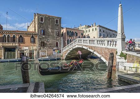 Picture - Gondola on the Ponte delle Guglie, and Ponte di Cannaregio, Canale di Cannaregio, Cannaregio, Venice, Veneto, Italy, Europe. Fotosearch
