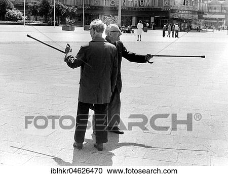 Stock Image - Grandpas with sticks, ca. 1980s, East Berlin, GDR, Germany, Europe. Fotosearch