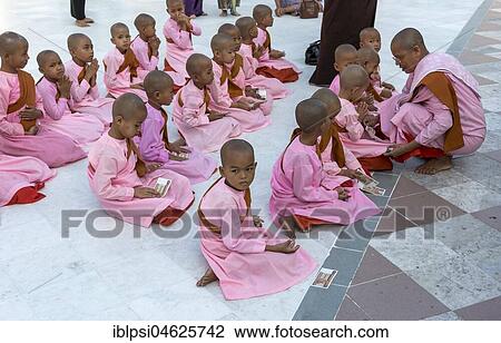 Group of renunciants in pink robes pray at Shwedagon Pagoda, Yangon, Rangoon, Myanmar, Burma, Asia View Large Photo Image Stock Image - Group of renunciants in pink robes pray at Shwedagon Pagoda, Yangon, Rangoon, Myanmar, Burma, Asia. Fotosearch