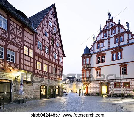 Stock Photo - Half-timbered houses on the market and Stadthaus building, dusk, Coburg, Upper Franconia, Bavaria, Germany, Europe. Fotosearch