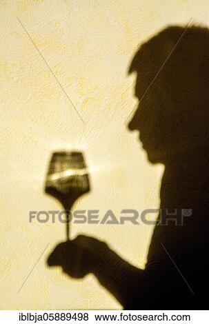 Hand holding a glass of wine, France, Europe View Large Photo Image Stock Photo - Hand holding a glass of wine, France, Europe. Fotosearch