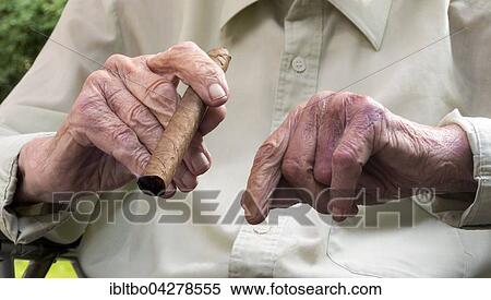 Hands of an old man with cigar, retirement home, Berlin, Germany, Europe View Large Photo Image Stock Photography - Hands of an old man with cigar, retirement home, Berlin, Germany, Europe. Fotosearch