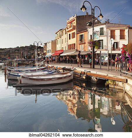 Harbour promenade reflected in water, Cassis, Provence, Provence-Alpes-Cote d'Azur, Southern France, France, Europe View Large Photo Image Picture - Harbour promenade reflected in water, Cassis, Provence, Provence-Alpes-Cote d'Azur, Southern France, France, Europe. Fotosearch