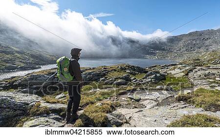 Hiker on a path, Klafferkessel with small mountain lakes, Oberer Klaffersee, Greifenberg, Rohrmoos-Untertal, Schladming Tauern, Styria, Austria, Europe View Large Photo Image Stock Photography - Hiker on a path, Klafferkessel with small mountain lakes, Oberer Klaffersee, Greifenberg, Rohrmoos-Untertal, Schladming Tauern, Styria, Austria, Europe. Fotosearch