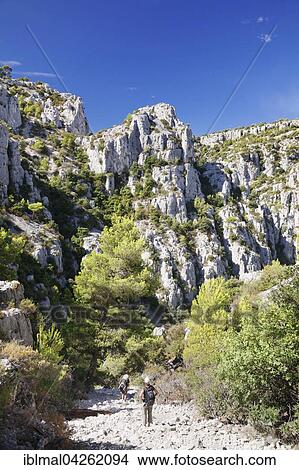 Hikers in Calanques National Park or Parc National des Calanques, Cassis, Provence, Provence-Alpes-Cote d'Azur, Southern France, France, Europe View Large Photo Image Picture - Hikers in Calanques National Park or Parc National des Calanques, Cassis, Provence, Provence-Alpes-Cote d'Azur, Southern France, France, Europe. Fotosearch