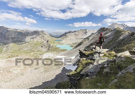 Hikers on the Jöriflüelafurgga with view of the Jörisee lakes, Davos, Graubünden, Switzerland, Europe View Large Photo Image Stock Image - Hikers on the Jöriflüelafurgga with view of the Jörisee lakes, Davos, Graubünden, Switzerland, Europe. Fotosearch