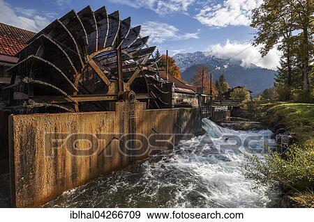 Stock Photo - Historical hammer mill, water wheel in the Ostrich stream, Bad Oberdorf in Bad Hindelang, Allgau, Bavaria, Germany, Europe. Fotosearch