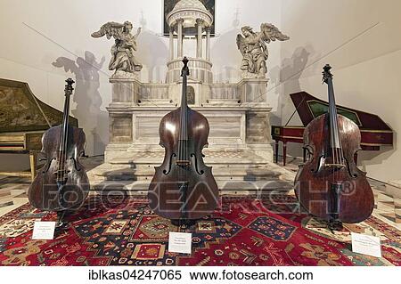 Historical instruments, double basses of Bergonzi and Amati, Museo della Musica in the church of San Maurizio, San Marco, Venice, Veneto, Italy, Europe View Large Photo Image Stock Photography - Historical instruments, double basses of Bergonzi and Amati, Museo della Musica in the church of San Maurizio, San Marco, Venice, Veneto, Italy, Europe. Fotosearch