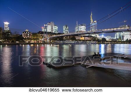 Holbeinsteg, pedestrian bridge over the Main River with a skyline at dusk, Frankfurt am Main, Hesse, Germany, Europe View Large Photo Image Stock Photography - Holbeinsteg, pedestrian bridge over the Main River with a skyline at dusk, Frankfurt am Main, Hesse, Germany, Europe. Fotosearch