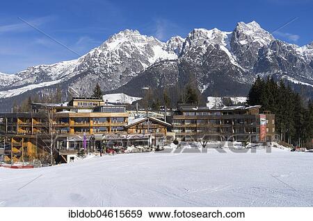 Holzhotel Forsthofalm in front of the Leoganger Steinbergen, Ski area Saalbach Hinterglemm Leogang Fieberbrunn, Leogang, Salzburger Land, Austria, Europe View Large Photo Image Stock Photo - Holzhotel Forsthofalm in front of the Leoganger Steinbergen, Ski area Saalbach Hinterglemm Leogang Fieberbrunn, Leogang, Salzburger Land, Austria, Europe. Fotosearch