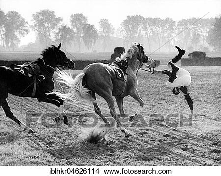 Horse-rider falls from the horse about 1970s, exact place unknown, Czech Republic, Europe View Large Photo Image Picture - Horse-rider falls from the horse about 1970s, exact place unknown, Czech Republic, Europe. Fotosearch